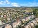 Aerial view of a suburban neighborhood featuring a home with a large backyard and mountain views at 3535 E Melody Ln, Gilbert, AZ 85234