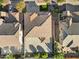 Aerial shot of a home's roof, highlighting the tile work, backyard, and nearby greenery at 3535 E Melody Ln, Gilbert, AZ 85234