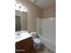 Bathroom with tub, toilet, and vanity with mirror at 812 W Saint Anne Ave, Phoenix, AZ 85041