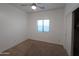 Simple bedroom with ceiling fan and window blinds at 812 W Saint Anne Ave, Phoenix, AZ 85041