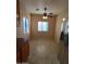 Bright dining area adjacent to the kitchen with tile flooring at 812 W Saint Anne Ave, Phoenix, AZ 85041