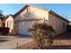 Single-story house with a two-car garage and well-maintained landscaping at 812 W Saint Anne Ave, Phoenix, AZ 85041