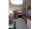 Kitchen with stainless steel appliances and ample wood cabinetry at 812 W Saint Anne Ave, Phoenix, AZ 85041