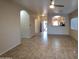 Open concept living area with tile floors and views into the kitchen at 812 W Saint Anne Ave, Phoenix, AZ 85041