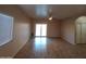 Spacious living room featuring tile flooring and sliding glass doors at 812 W Saint Anne Ave, Phoenix, AZ 85041