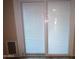 Sliding glass door with white mini blinds at 812 W Saint Anne Ave, Phoenix, AZ 85041