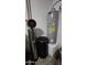 Utility closet with water heater and filtration system at 812 W Saint Anne Ave, Phoenix, AZ 85041