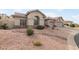 One-story home with tile roof, two-car garage, and desert landscaping at 1337 E Ludlow Dr, Phoenix, AZ 85022