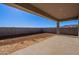 Covered patio overlooks a spacious backyard at 18955 W Ocotillo Rd, Waddell, AZ 85355