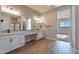 Bathroom with double vanity, granite countertop, and view to bedroom at 18955 W Ocotillo Rd, Waddell, AZ 85355