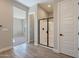 Bathroom with a glass shower, and neutral color palette at 18955 W Ocotillo Rd, Waddell, AZ 85355