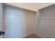 Well-lit closet with hanging rods and shelving for storage at 18955 W Ocotillo Rd, Waddell, AZ 85355