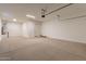 Spacious garage with door, extra storage, and water heater at 18955 W Ocotillo Rd, Waddell, AZ 85355