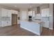 Modern kitchen featuring white shaker cabinets, granite counters, and stainless steel appliances at 18955 W Ocotillo Rd, Waddell, AZ 85355