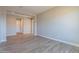 Open living room with wood-look tile floors and neutral wall colors at 18955 W Ocotillo Rd, Waddell, AZ 85355