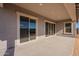 Covered patio with sliding glass doors leading to backyard at 18955 W Ocotillo Rd, Waddell, AZ 85355