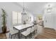 Elegant dining room featuring a large table, chandelier, and hardwood floors at 20722 N 38Th St, Phoenix, AZ 85050