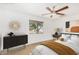 Inviting bedroom with a ceiling fan, a window with view, and stylish furnishings at 3033 E Sierra St, Phoenix, AZ 85028