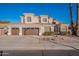 Attractive two-story home featuring a three-car garage, well-maintained landscaping, and a concrete driveway at 1663 S Boulder St, Gilbert, AZ 85295
