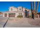 Gorgeous two-story home with a three-car garage, desert landscaping and great curb appeal at 1663 S Boulder St, Gilbert, AZ 85295