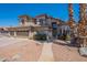 Stunning two-story home with a three-car garage, a tile roof, desert landscaping and attractive curb appeal at 1663 S Boulder St, Gilbert, AZ 85295