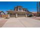 Charming two-story home featuring a wide driveway and a three-car garage, perfect for car enthusiasts at 1663 S Boulder St, Gilbert, AZ 85295