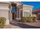 Close-up view of a charming front entrance with a stylish door, decorative accents, and inviting walkway at 1663 S Boulder St, Gilbert, AZ 85295
