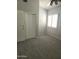 Bright bedroom with soft carpet, a window with shutters, a fan, and a double door closet at 19537 N 69Th Ave, Glendale, AZ 85308
