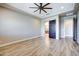 Bedroom with a ceiling fan and adjoining en-suite bathroom at 21715 N 61St Way, Phoenix, AZ 85054