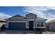 Charming single-story home featuring a two-car garage, neutral tones, and modern architectural details at 25383 W Sunland Ave, Buckeye, AZ 85326