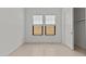 Well-lit bedroom with carpet, closet and windows with blinds at 4405 N 203Rd Ave, Buckeye, AZ 85396