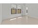 Bedroom featuring neutral tile, large window, and baseboards at 4405 N 203Rd Ave, Buckeye, AZ 85396