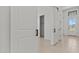 Hallway with tile flooring, closet, and front door at 4405 N 203Rd Ave, Buckeye, AZ 85396