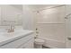 Bathroom offers shower over bath, white cabinets and an updated vanity sink at 11612 W Beck Dr, Youngtown, AZ 85363