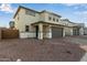 Charming two-story home with a two-car garage, landscaped front yard, and inviting entry at 11612 W Beck Dr, Youngtown, AZ 85363