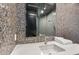 Modern bathroom with mosaic tile wall, sleek vanity, and glass-enclosed shower at 4880 E Lone Mountain N Rd, Cave Creek, AZ 85331