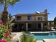 Inviting backyard oasis with a sparkling pool, spa, covered patio, and solar panels for energy efficiency at 1201 E Le Marche Ave, Phoenix, AZ 85022