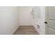 Functional laundry room with neutral paint, a shelf, wood-look floors, and washer/dryer hookups at 18428 W Robin Ln, Surprise, AZ 85387