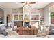 Bright living room with built-in shelving, a fireplace, and hardwood floors at 4565 E Pinnacle Vista Dr, Cave Creek, AZ 85331