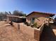 A welcoming backyard featuring a cozy patio and lush greenery for outdoor relaxation at 7706 N 173Rd Ave, Waddell, AZ 85355