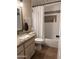 Bathroom featuring a tiled shower and granite vanity at 7706 N 173Rd Ave, Waddell, AZ 85355