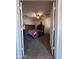 Bedroom with carpet, ceiling fan, and a double door closet at 7706 N 173Rd Ave, Waddell, AZ 85355