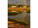 Picturesque property with a rainbow and pond reflecting the home and a trio of ducks taking flight overhead at 7706 N 173Rd Ave, Waddell, AZ 85355