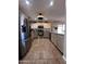 A well-appointed kitchen featuring stainless steel appliances and granite countertops at 7706 N 173Rd Ave, Waddell, AZ 85355