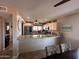 A lovely kitchen featuring granite countertops, stainless steel appliances, and ample cabinet space at 7706 N 173Rd Ave, Waddell, AZ 85355