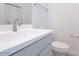 Clean bathroom with single sink, toilet and gray vanity at 876 W Golden Ore Pass, Apache Junction, AZ 85120