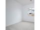 Bright bedroom with carpeted floor and large window at 876 W Golden Ore Pass, Apache Junction, AZ 85120