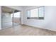 Bright bedroom with tile flooring and sliding glass door to backyard at 876 W Golden Ore Pass, Apache Junction, AZ 85120