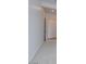 Carpeted hallway with doors to bedrooms at 876 W Golden Ore Pass, Apache Junction, AZ 85120