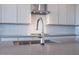 Modern kitchen sink and faucet with grey countertops at 876 W Golden Ore Pass, Apache Junction, AZ 85120